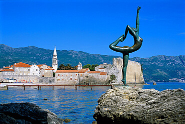 Statue and view of Old Town, Budva, The Budva Riviera, Montenegro, Europe