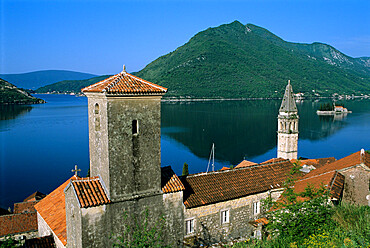 View over village and bay with island of St. George, Perast, The Boka Kotorska (Bay of Kotor), UNESCO World Heritage Site, Montenegro, Europe