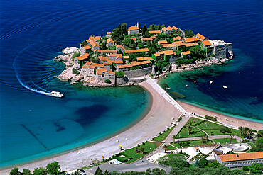 Aerial view over the island and beaches, Sveti Stefan, The Budva Riviera, Montenegro, Europe