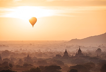 View of hot air balloon and temples at dawn, Bagan (Pagan), Mandalay Region, Myanmar (Burma), Asia