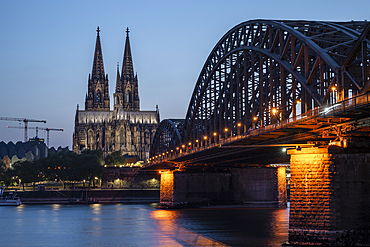 Cologne Cathedral, UNESCO World Heritage Site, and Hohenzollern Bridge at dusk, Cologne, North Rhine-Westphalia, Germany, Europe