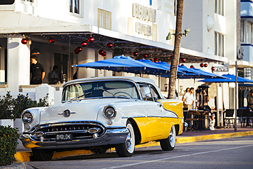 Oldsmobile Super 88 convertible parked in front of the Avalon Hotel, Ocean Drive, South Beach, Miami, Dade County, Florida, United States of America, North America