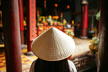 Vietnamese woman in ao dai at Quang Cong Temple, Hoi An, Quảng Nam Province, Vietnam