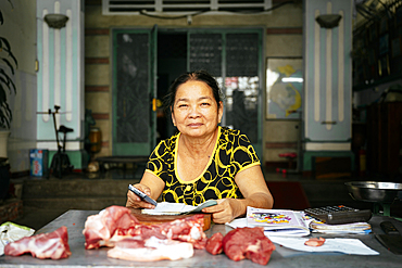 Portrait of Nga at her butcher shop, Saigon, Ho Chi Minh City, Vietnam