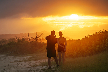 Tourists watching sunset, Isla Isabela, Galapagos Islands, Ecuador