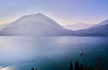 High angle view of Lake Como with a ferry boat travelling across the lake, Lombardy, Italian Lakes, Italy, Europe