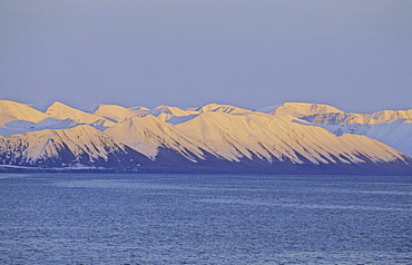 Pinkish evening sun on the mountain slopes of Northern Spitsbergen. 