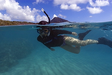 Split image of snorkeller hovering over sandy substrate, Hanauma Bay, Oahu, Hawaii, United States of America, Pacific