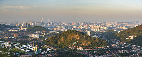 Kuala Lumpur skyline seen at sunrise from Bukit Tabur Mountain, Malaysia, Southeast Asia, Asia