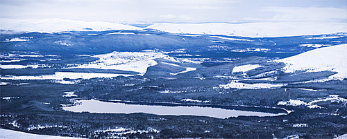 Loch Morlich covered in snow in winter, Aviemore, Cairngorms National Park, Scotland, United Kingdom, Europe