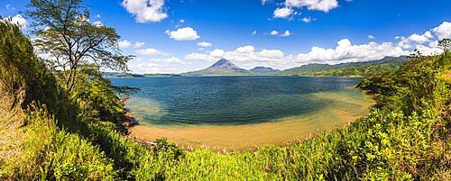 Arenal Volcano behind Laguna de Arenal (Arenal Lake), Alajuela Province, Costa Rica, Central America