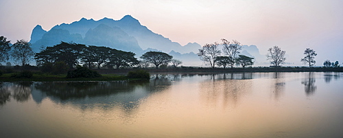 Misty morning at Kyauk Kalap Buddhist Temple at sunrise, Hpa An, Kayin State, Myanmar (Burma), Asia