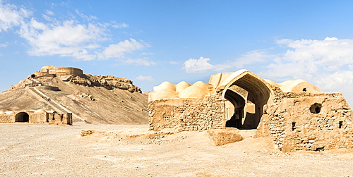 Ruins of ritual buildings in front of Dakhmeh Zoroastrian Tower of Silence, Yazd, Iran, Middle East