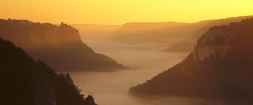 View from Eichfelsen Rock on Schloss Werenwag Castle and Danube Valley at sunrise, Upper Danube Nature Park, Swabian Alb, Baden Wurttemberg, Germany, Europe