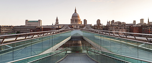 Millennium Bridge and St. Paul's Cathedral at sunrise, London, England, United Kingdom, Europe