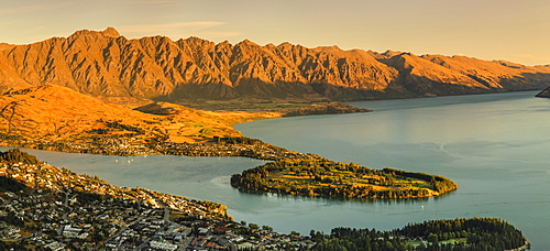 View over Queenstown and Lake Wakatipu to The Remarkables Mountains at sunset, Otago, South Island, New Zealand, Pacific