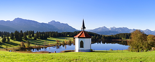 Chapel at Hergratsrieder See lake with Allgau Alps, near Fussen, Allgau, Ostallgau, Bavaria, Germany, Europe