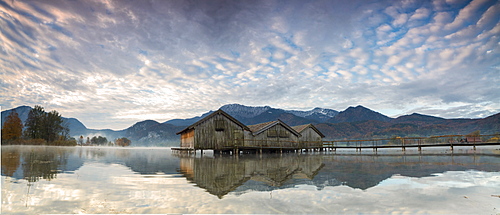 Panorama of Kochelsee framed by pink clouds at sunset, Schlehdorf, Bavaria, Germany, Europe