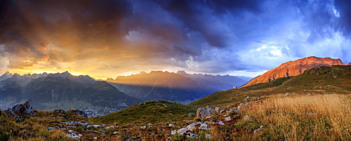 Panorama of the fiery sky on high peaks of Muottas Muragl at sunset, St. Moritz,  Canton of Graubunden, Engadine, Switzerland, Europe