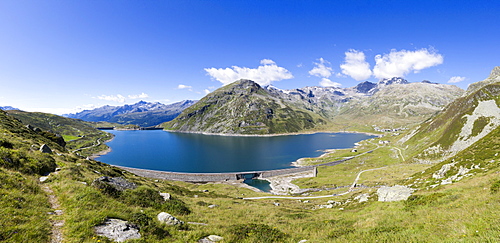 Panorama of the blue Lake Montespluga surrounded by rocky peaks in summer, Chiavenna Valley, Valtellina, Lombardy, Italy, Europe