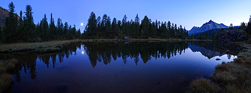 Panorama of the blue Lake Mufule lit by the moon, Malenco Valley, Province of Sondrio, Valtellina, Lombardy, Italy, Europe