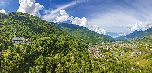 Aerial view of church and green hills around Sazzo, Ponte In Valtellina, Sondrio province, Lombardy, Italy, Europe