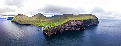 Panoramic aerial view of cliffs and village of Gjogv, Eysturoy island, Faroe Islands, Denmark, Europe