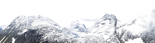 Aerial panoramic of Store Venjetinden and Olaskarstinden mountains covered with snow, Venjesdalen valley, Romsdalen, Rauma, Norway, Scandinavia, Europe