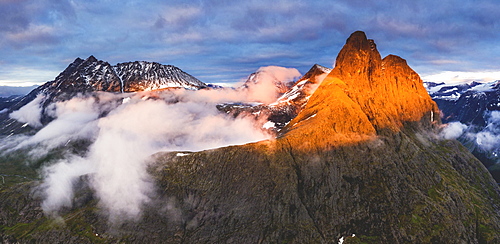 Aerial view of Romsdalshornet and Venjetinden mountain lit by sunset, Romsdalen valley, Andalsnes, More og Romsdal, Norway, Scandinavia, Europe