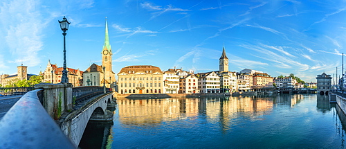 Panoramic of Fraumunster church and Limmat River seen from Munsterbrucke bridge at sunrise, Zurich, Switzerland, Europe