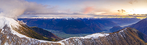 Sunset on the autumnal landscape of Scermendone Alp and Orobie Alps, aerial view by drone, Rhaetian Alps, Valtellina, Lombardy, Italy, Europe