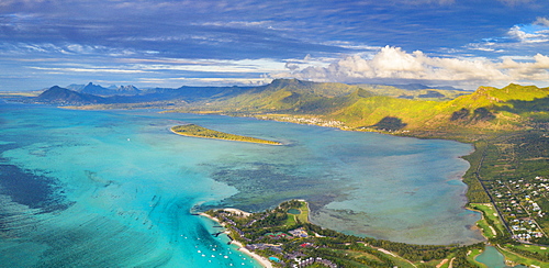 Aerial panoramic of turquoise lagoon surrounding Aux Benitiers and La Gaulette, Le Morne Brabant, Mauritius, Indian Ocean, Africa