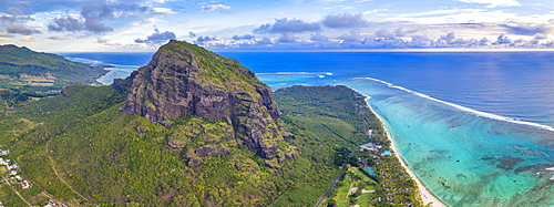 Majestic mountain overlooking the ocean and coral reef, aerial panoramic, Le Morne Brabant peninsula, Mauritius, Indian Ocean, Africa