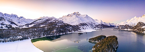 Aerial panoramic of Piz Da La Margna and Lake Sils during a winter sunrise, Engadine, canton of Graubunden, Switzerland, Europe