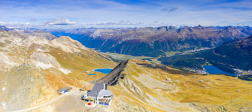 Aerial panoramic by drone of Piz Nair, Lej Alv lake and St. Moritz in background, Engadine, canton of Graubunden, Switzerland, Europe