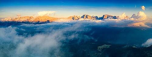 Aerial panoramic view of Brenta Dolomites emerging from clouds, Madonna di Campiglio, Trento, Trentino-Alto Adige, Italy, Europe