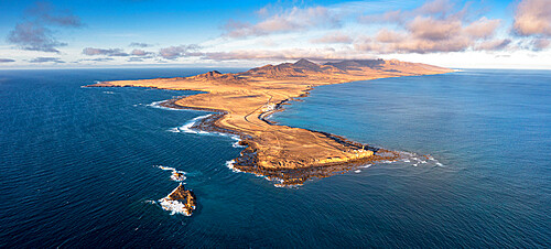 Aerial panoramic of Punta Jandia lighthouse (Faro de la Lola) and Atlantic Ocean at sunset, Fuerteventura, Canary Islands, Spain, Atlantic, Europe