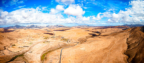 Aerial view of desert landscape and mountains crossed by asphalt road, Tefia, Fuerteventura, Canary Islands, Spain, Atlantic, Europe