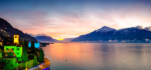 Christmas lights dressing the old bell tower in Gravedona lakeside town at dawn, Lake Como, province of Como, Lombardy, Italian Lakes, Italy, Europe