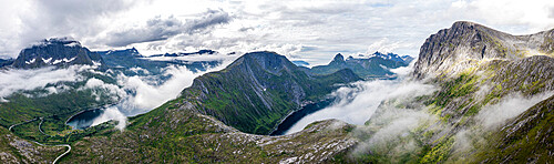 Aerial view of Barden, Breidtinden, Segla mountains and Ornfjord in a sea of clouds, Senja island, Troms county, Norway, Scandinavia, Europe