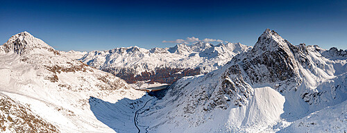 Aerial view of Julier Pass mountain road in the snow leading to St. Moritz in winter, Engadine, Graubunden canton, Switzerland, Europe