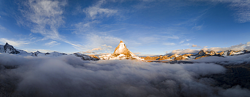 Aerial panoramic view of Matterhorn in autumn fog at dawn, Zermatt, Valais canton, Switzerland, Europe