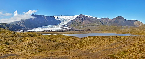 A retreating glacier, pouring down from the Vatnajokull icecap, in Skaftafell National Park, southern Iceland, Polar Regions