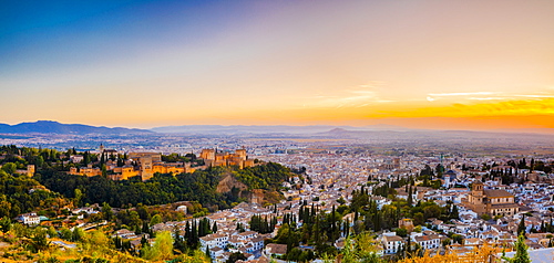 View of Alhambra, UNESCO World Heritage Site, and Sierra Nevada mountains at dusk, Granada, Andalucia, Spain, Europe