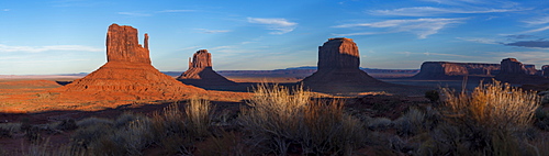 A panoramic image of the giant sandstone buttes at sunset in Monument Valley Navajo Tribal Park, Arizona, United States of America, North America