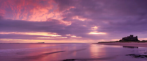 Sunrise over Bamburgh Castle and the Farne Islands, Northumberland, England, United Kingdom, Europe