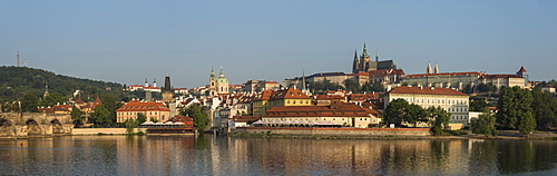 Panorama of Prague Castle, Hradcany, Mala Strana, and Charles Bridge lit by sunrise, UNESCO World Heritage Site, Prague, Czech Republic, Europe