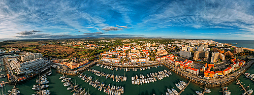 Aerial view of the tourist Portuguese town of Vilamoura, with yachts and sailboats moored in the port on the marina, Algarve, Portugal, Europe