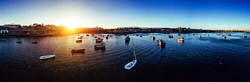 Aerial drone panoramic view of sunset at Cascais Bay, in the Lisbon region of the Portuguese Riveira, Europe