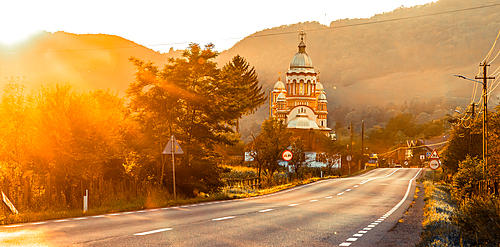 road and church in golden hour